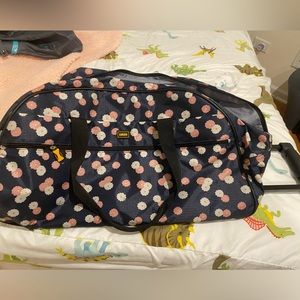 Lucas brand pink and white navy florals rolling duffel, good condition used 2x